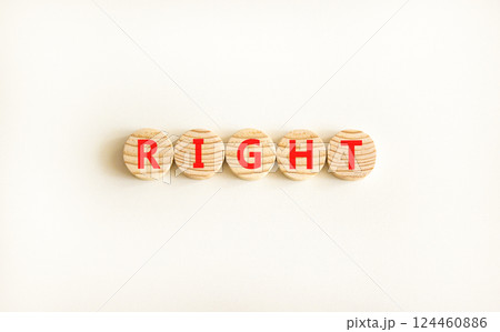 Right symbol. Concept word Right on beautiful wooden circles. Beautiful white table white background. Business lifestyle right concept. Copy space. 124460886