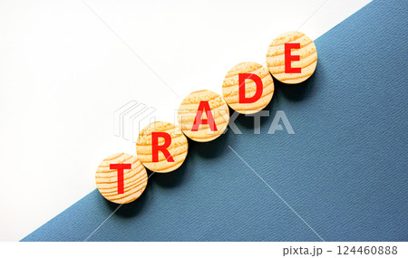 Trade symbol. Concept word Trade on beautiful wooden circles. Beautiful white and blue background. Business lifestyle trade concept. Copy space. 124460888
