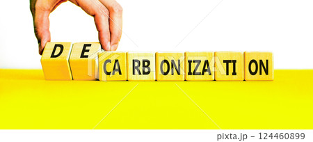 Decarbonization or carbonization symbol. Concept words Decarbonization or Carbonization on wooden blocks. Beautiful white background. Business decarbonization or carbonization concept. Copy space. 124460899