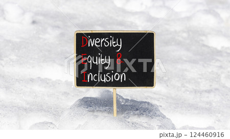 DEI diversity equity and inclusion symbol. Concept words DEI diversity equity and inclusion on blackboard. Beautiful snow background. Business DEI diversity equity and inclusion concept. Copy space. 124460916