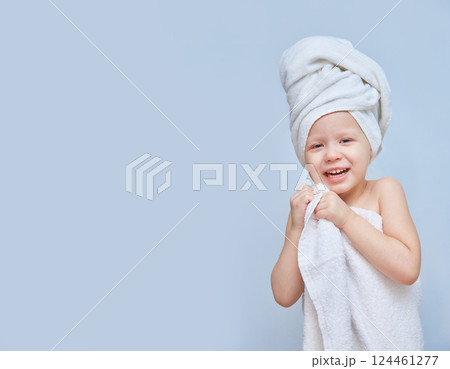 Laughing girl dressed in a white towel. Spa day in a beauty salon. Towel on the head. Daughter at the Spa. Beauty salon concept. beautiful face. Happy child. Copy space or space for a product. Laughing girl dressed in a white towel. Spa day in a beauty salon. Towel on the head. Daughter at the Spa. Beauty salon concept. beautiful face. Happy child. Copy space or space for a product. 124461277
