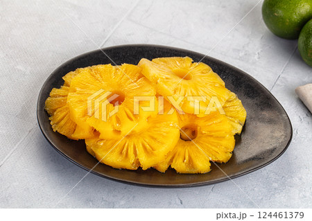 Sweet canned pineapple slices in syrope Sweet canned pineapple slices in syrope 124461379