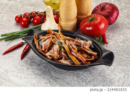 Sliced smoked pork ear snack 124461833