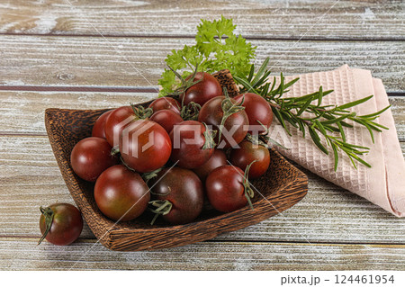Juicy ripe black cherry tomato 124461954