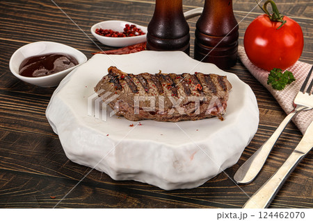 Grilled beef striploin steak with sauce 124462070