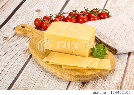 Yellow cheese piece with slices Yellow cheese piece with slices 124462106