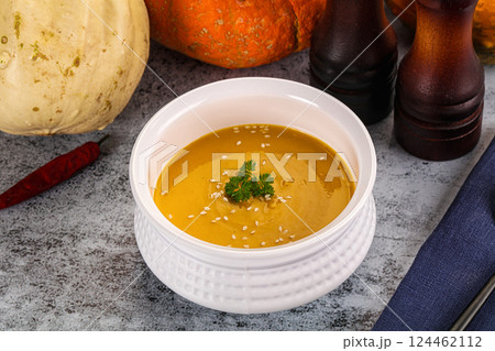 Vegan pumpkin cream soup served sesam 124462112