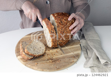 Freshly baked bread on a cutting board. 124462921
