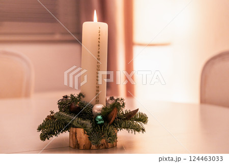 Christmas advent candle whith numbers. Christmas decor and holiday preparations 124463033
