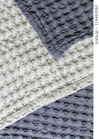 Textile background soft textured cotton fabric in gray tones 124463062