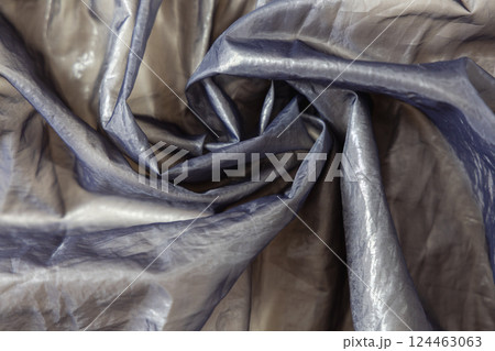 Beautiful textile background metallic shiny silk texture. 124463063
