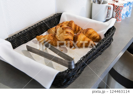 Fresh croissants in a bastet in a hotel kitchen. 124463114
