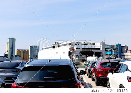 Seaport and terminal for passenger ferry transport in the city of Ystad. Line of cars waiting to board the ferry. 124463123