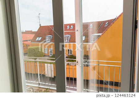 Open window overlooking the street on a summer day 124463124