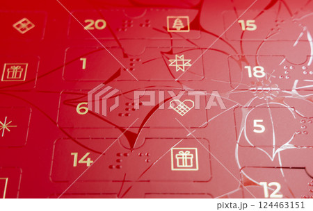 Red advent calendar for kids and adults with sweets 124463151