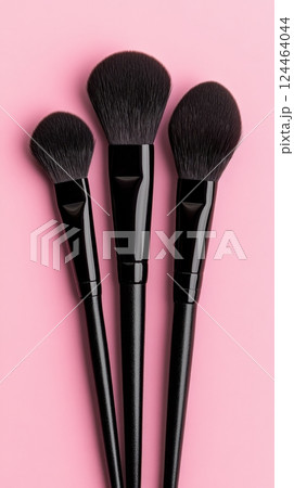 Display of black makeup brushes 124464044