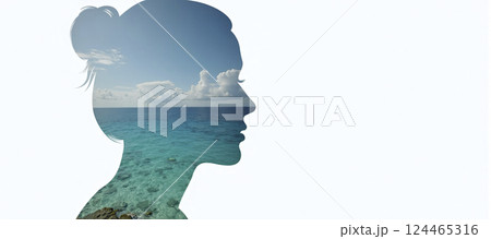 The silhouette of a female head depicting a calm and relaxed landscape, relaxation exercises, stress management and positive thinking 124465316