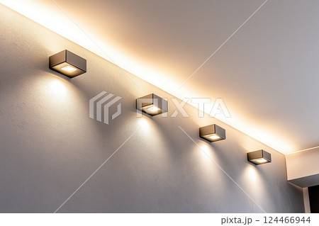 Lighting equipment on the wall in the living room. Spotlights under the ceiling. Track LED-lighting system 124466944