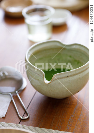 Closeup of fresh matcha tea froth, green tea. 124470051