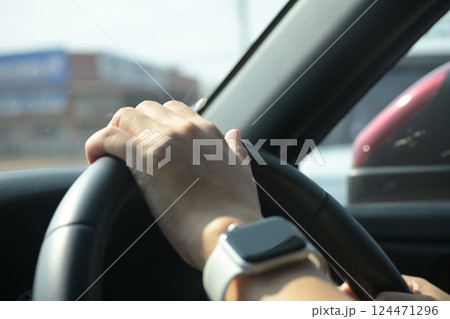 female driver hand hold steering wheel drive vehicle car rode trip travel female driver hand hold steering wheel drive vehicle car rode trip travel 124471296