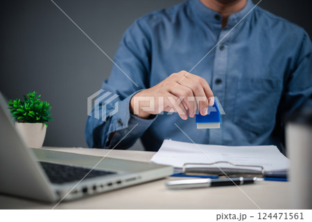 Rubber stamp for approving contracts, legal documents, and business certificates with guaranteed authorization. used by notaries for tax papers, visas, and work permit services Rubber stamp for approving contracts, legal documents, and business certificates with guaranteed authorization. used by notaries for tax papers, visas, and work permit services 124471561