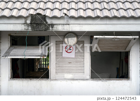 Old security guard booth with Weathered and Faded paint (Guardhouse). 124472543