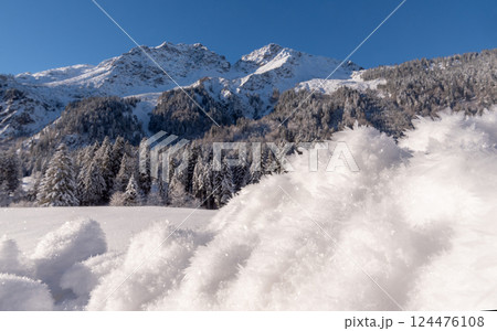 Snowy scenery on a sunny day in the Bavarian Alps, in Oberstdorf, Germany 124476108