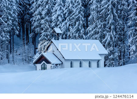 Winter landscape with a church minimalist in a deep snow nature, in the Bavarian Alps, Germany 124476114