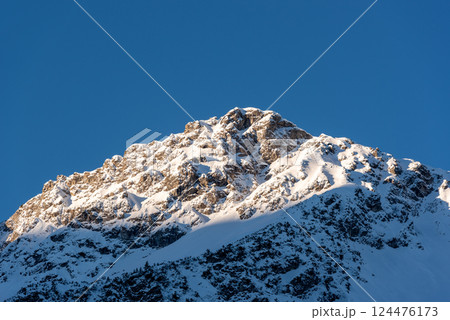 Mountain peak in the Bavarian Alps covered in snow on a sunny day in December Mountain peak in the Bavarian Alps covered in snow on a sunny day in December 124476173