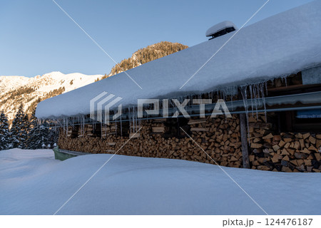 Snow-covered mountain cabin in an alpine scenery in Bavaria, Germany Snow-covered mountain cabin in an alpine scenery in Bavaria, Germany 124476187