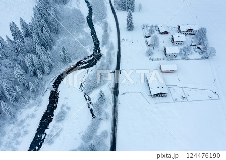 Snow-covered mountain valley, drone aerial view in the Allgau Alps, Germany Snow-covered mountain valley, drone aerial view in the Allgau Alps, Germany 124476190
