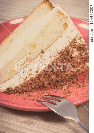 Sweet cake with different layers and chocolate. Delicious dessert for celebrations Sweet cake with different layers and chocolate. Delicious dessert for celebrations 124477007