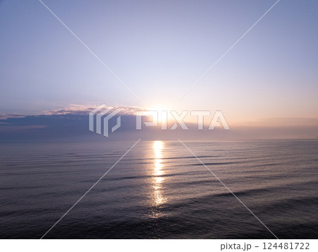 Aerial view sunset sky,Nature beautiful Light Sunset or sunrise over sea,Colorful dramatic majestic scenery sunset Sky with Amazing clouds and waves in sunset sky purple light cloud background 124481722