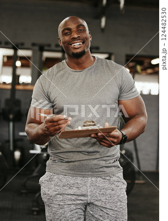 Gym membership, personal trainer and black man holding sign up clipboard for heath and wellness subscription for healthy lifestyle. Portrait of happy male coach holding paperwork to join fitness club Gym membership, personal trainer and black man holding sign up clipboard for heath and wellness subscription for healthy lifestyle. Portrait of happy male coach holding paperwork to join fitness club 124482530