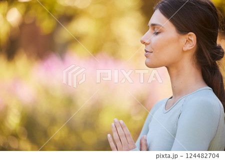 Calm, meditation and woman doing yoga in park for peace, quiet and zen. Healthy lifestyle, relax and hands of girl together to mediate in nature. Motivation, wellness and mindful exercise in morning 124482704