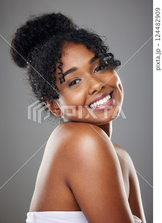 Skincare, beauty and cosmetics for black woman with perfect smile, dermatology and wellness routine against studio background. Jamaica girl portrait for wellness, health and facial for skin that glow 124482909