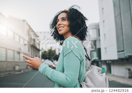 Happy, black woman and phone for travel in the city of a tourist enjoying sightseeing in an urban street. African American female traveler in communication or navigation on smartphone in South Africa Happy, black woman and phone for travel in the city of a tourist enjoying sightseeing in an urban street. African American female traveler in communication or navigation on smartphone in South Africa 124482916
