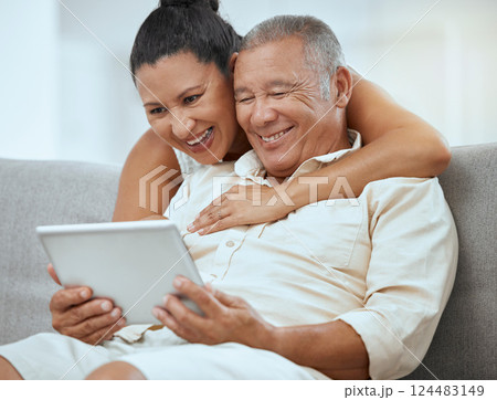 Senior couple, tablet and online in living room, social media news and ebook media app in Colombia home. Elderly retirement people, relax and digital social network, internet technology or connection 124483149