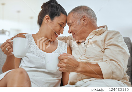 Love, coffee and elderly couple relax on a sofa, drinking coffee and embracing in a living room. Happy family, retirement and tea with mature man and woman smile, happy and enjoying romantic break Love, coffee and elderly couple relax on a sofa, drinking coffee and embracing in a living room. Happy family, retirement and tea with mature man and woman smile, happy and enjoying romantic break 124483150