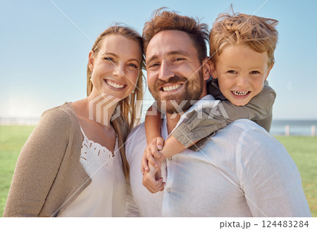 Park, portrait and happy family love being in nature outdoors to enjoy summer holidays, vacation or weekend. Excited child hugging or piggy backing on a healthy father by his relaxed mother in Sydney Park, portrait and happy family love being in nature outdoors to enjoy summer holidays, vacation or weekend. Excited child hugging or piggy backing on a healthy father by his relaxed mother in Sydney 124483284