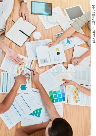 Finance, documents and meeting with a business team at a table in an office boardroom for planning from above. Accounting, growth and investment with a financial group working together in the office Finance, documents and meeting with a business team at a table in an office boardroom for planning from above. Accounting, growth and investment with a financial group working together in the office 124483344