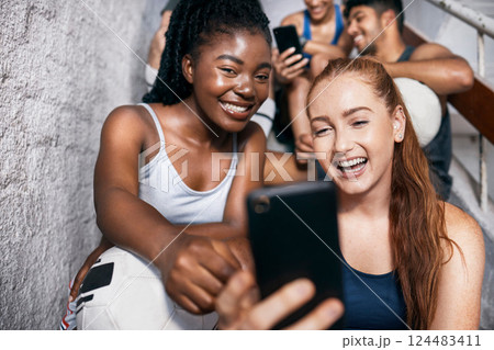 Selfie, friends and sports group on stairs after fitness workout training together. Smile, diversity happy men and women sport athletes positive bonding on social media video on smartphone app Selfie, friends and sports group on stairs after fitness workout training together. Smile, diversity happy men and women sport athletes positive bonding on social media video on smartphone app 124483411