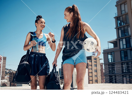 Fitness, friends and soccer women walking in city after workout, talk and bond against urban background. Health, wellness and sport ladies enjoy conversation before athletic, recreation and workout Fitness, friends and soccer women walking in city after workout, talk and bond against urban background. Health, wellness and sport ladies enjoy conversation before athletic, recreation and workout 124483421