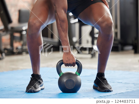 Gym, strong and fitness hand with kettlebell for body builder training, workout and cardio. Bodybuilder, exercise and muscle strength and endurance practice for athlete man at wellness club. 124483711