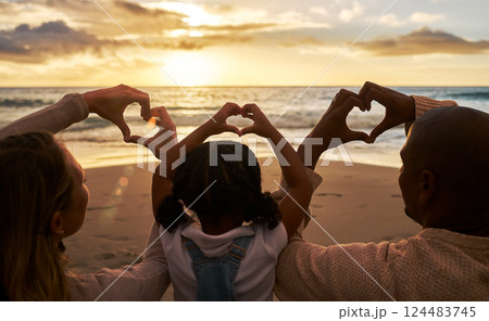 Beach, heart hands and family for love of summer, ocean and outdoor wellness with parents, child and sunset sky clouds . Behind of people, or mother and father with kid with care sign or icon for sea Beach, heart hands and family for love of summer, ocean and outdoor wellness with parents, child and sunset sky clouds . Behind of people, or mother and father with kid with care sign or icon for sea 124483745