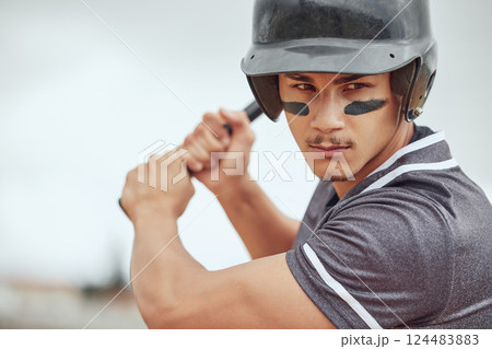 Focus, baseball and athlete with a bat on a field ready for the game or training with motivation. Mindset, fitness and man playing a softball match, sports exercise or workout on an outdoor pitch. 124483883