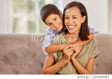 Boy, mother and sofa show love in home, happy and smile together in living room. Mom, child and couch love with happiness, hug and relax with affection in portrait at family home in Amsterdam 124484081