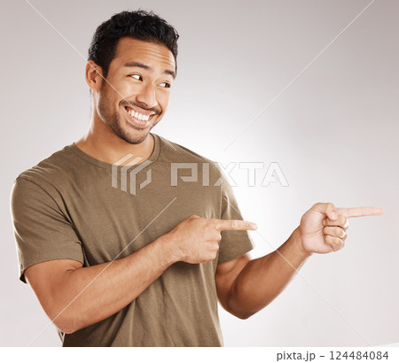 Studio, man and portrait with pointing for marketing, announcement and vote decision for offer. Space, salesperson and choice with hand gesture for promotion, advertising deal and white background 124484084