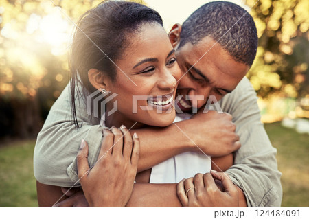 Love, black couple and hug being happy with smile, relax and being confident for marriage, relationship and together outdoor. Romance, man and woman enjoy holiday, embrace and holding for anniversary 124484091