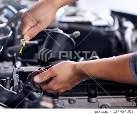 Closeup, car and engineer with tools for maintenance, repair and fixing in workshop at job. Hands, mechanic or working on motor, engine or vehicle in garage, workplace or shop for service in industry 124484308